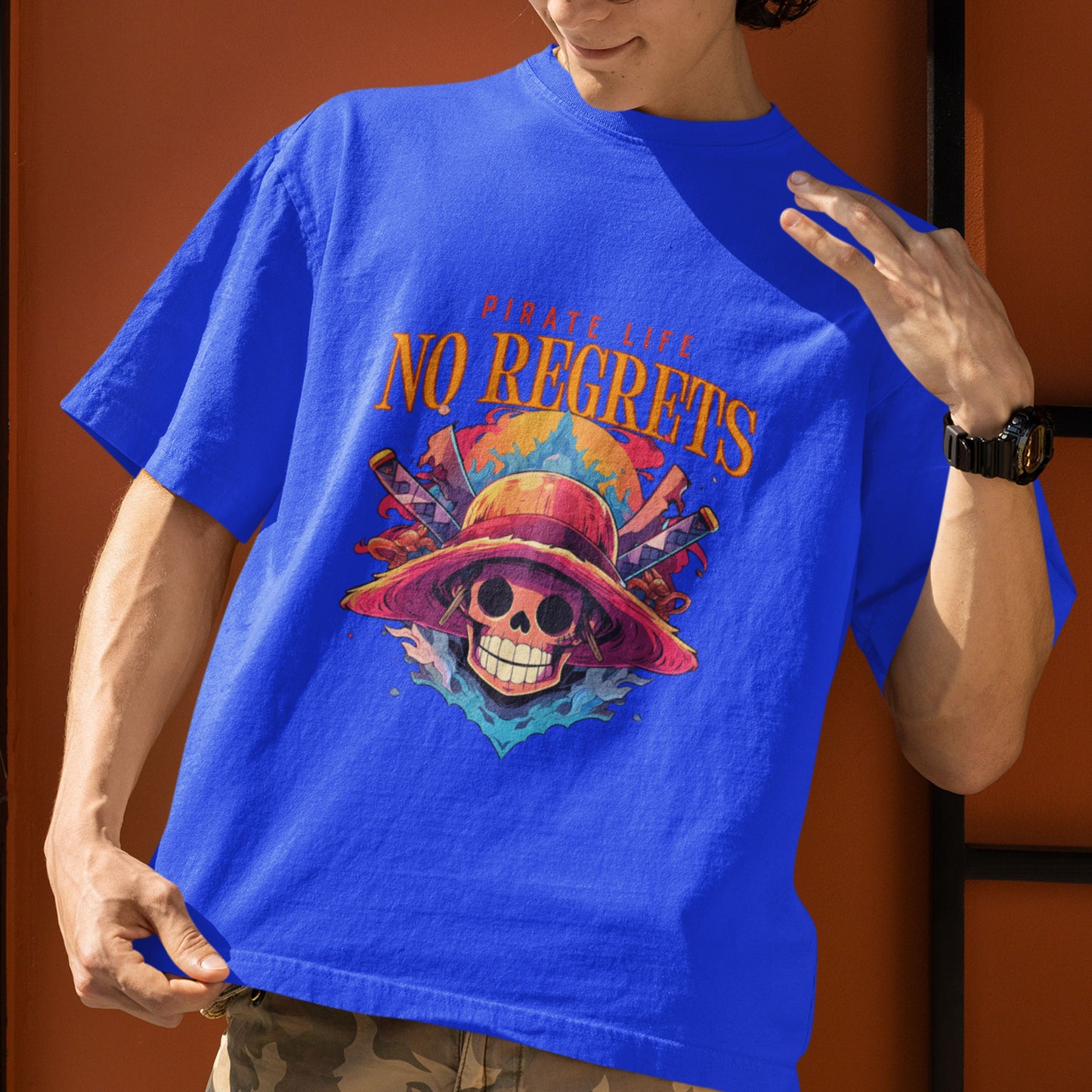 Male model in a royal blue oversized Pirate Life T-Shirt featuring anime graphics